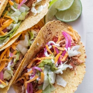 Chicken taos on a plate.