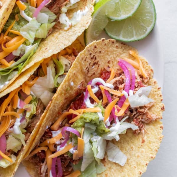 Chicken taos on a plate.