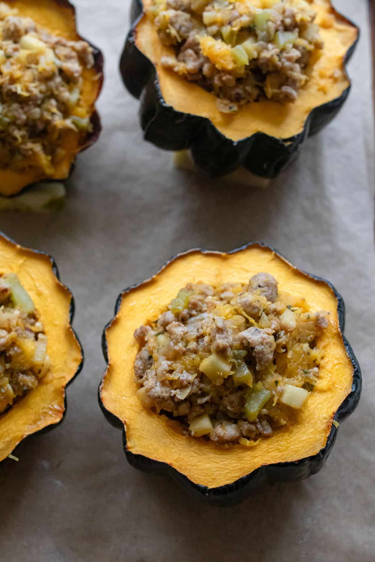 Sausage mixture added to hollowed out acorn squash.