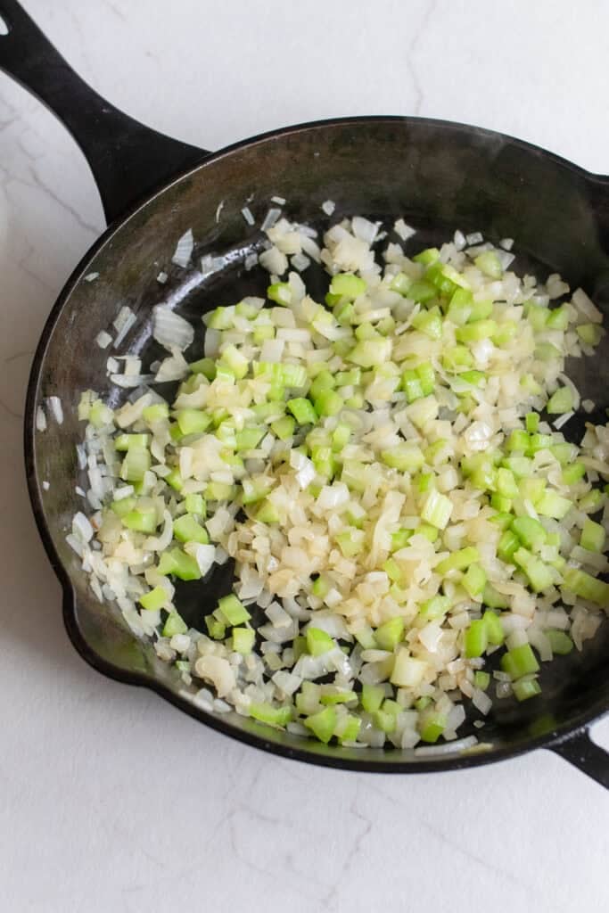 Veggies sautéed in a cast iron skillet.