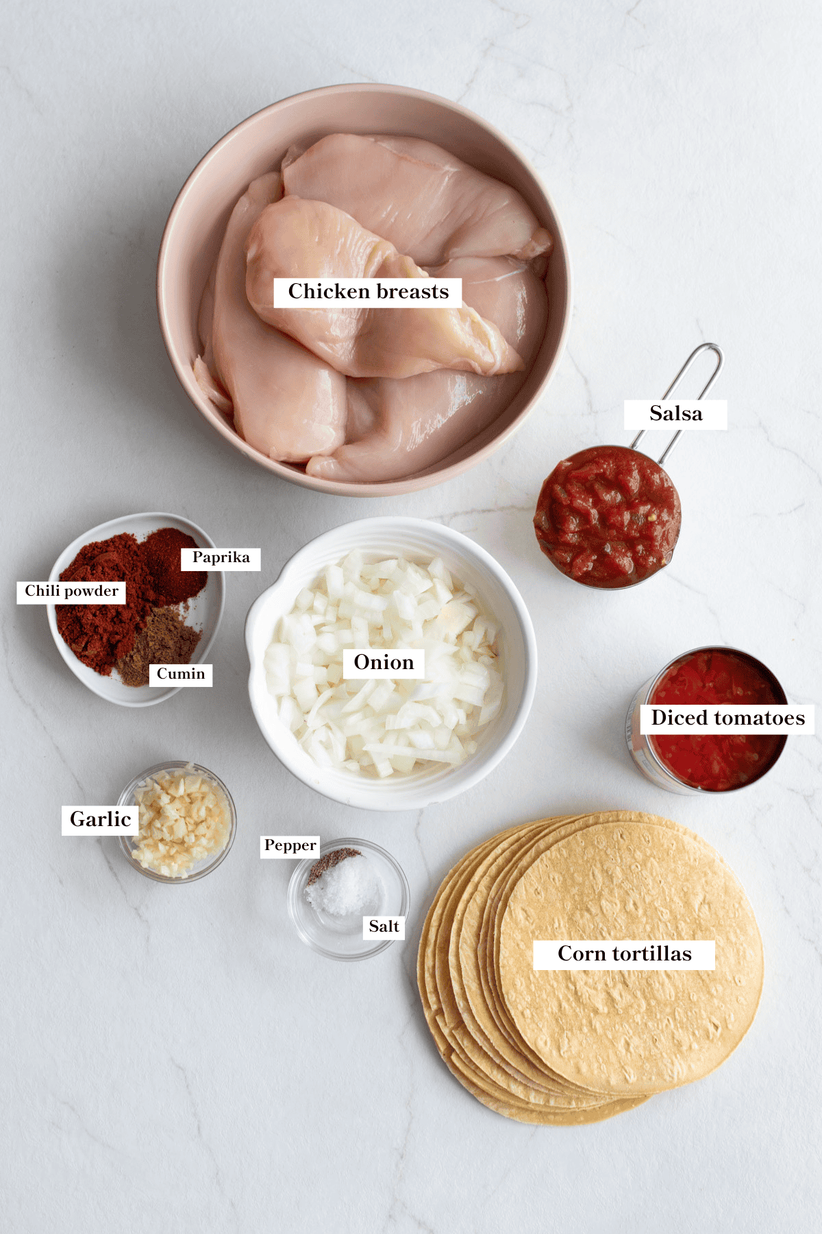 Ingredients for crock pot chicken tacos on a counter top.