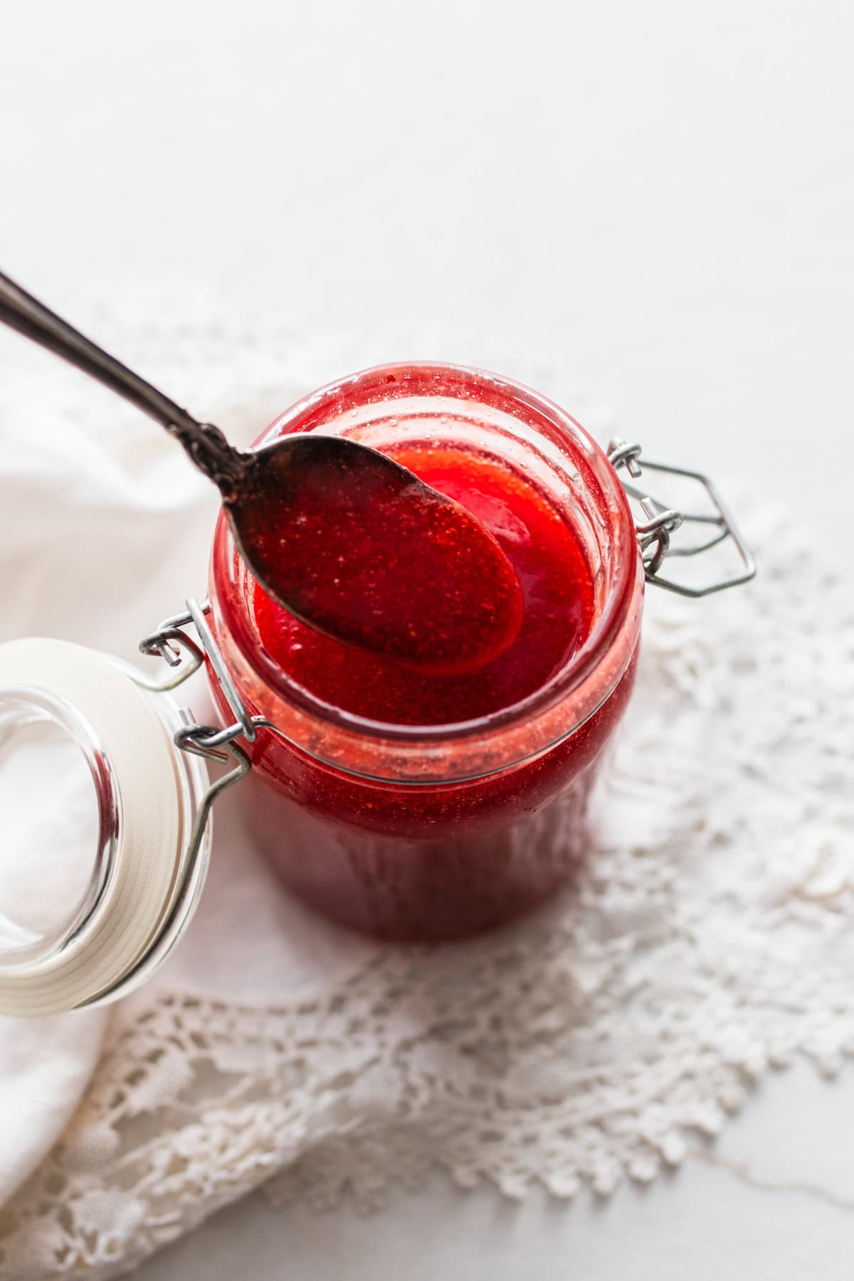 Sauce in a jar with a spoon.