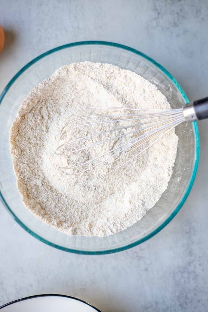 flour, salt, and baking powder whisked together in a glass bowl.