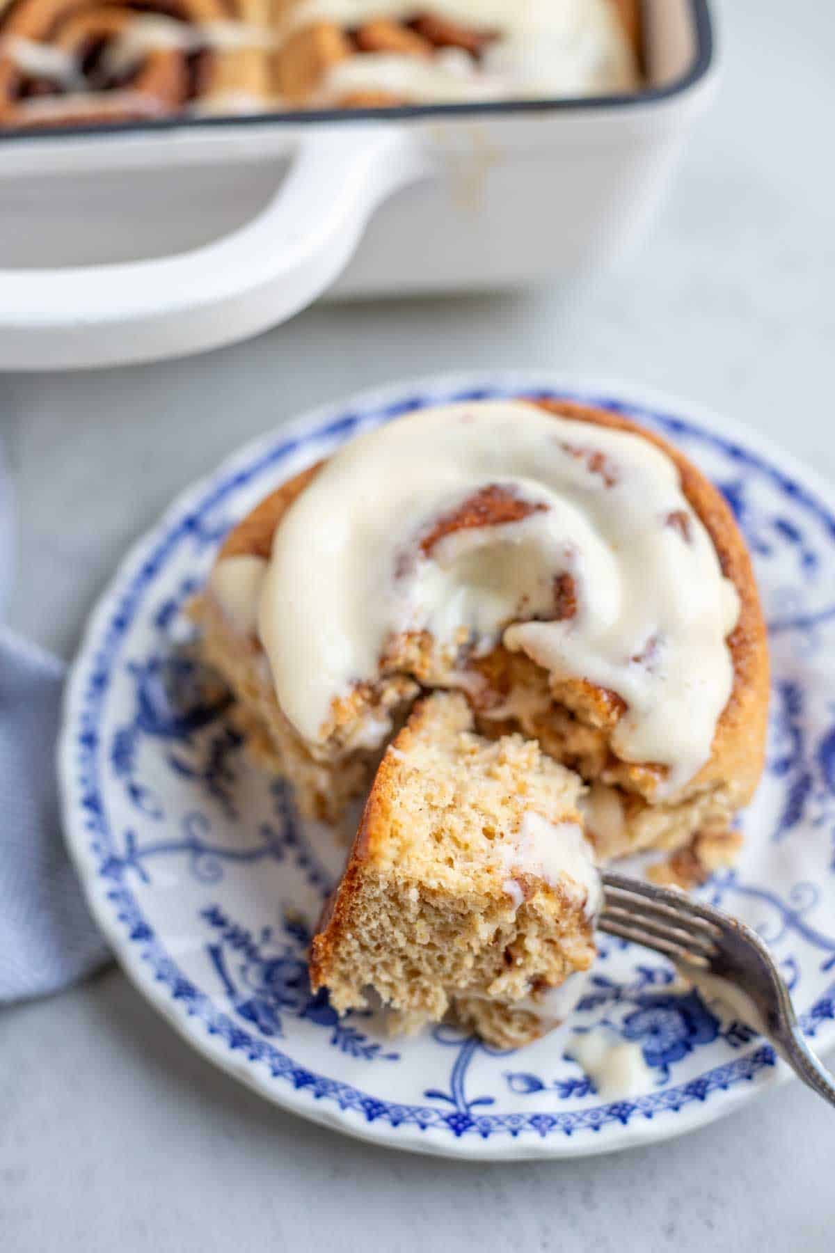 A cinnamon roll on a plate.