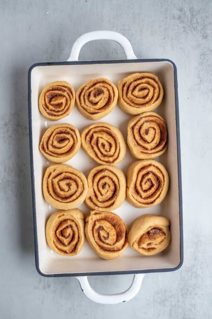 Cinnamon rolls that have risen and ready for oven.