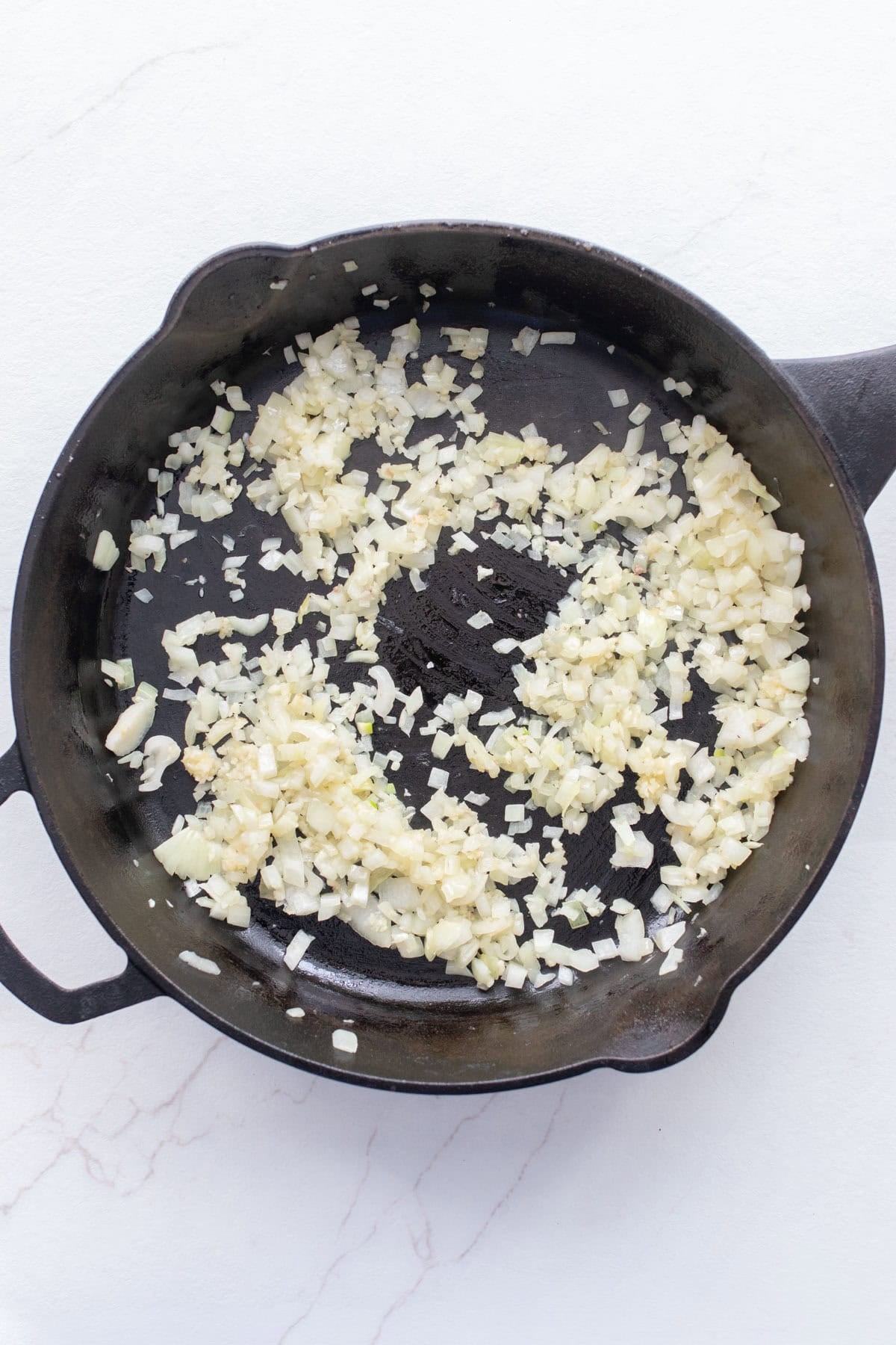 Onions in a cast iron skillet.