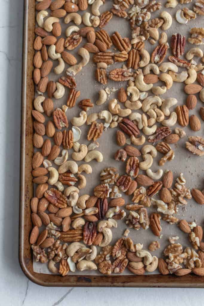 Roasted nuts on a baking sheet.