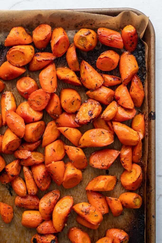 Carrots roasted on a baking sheet.