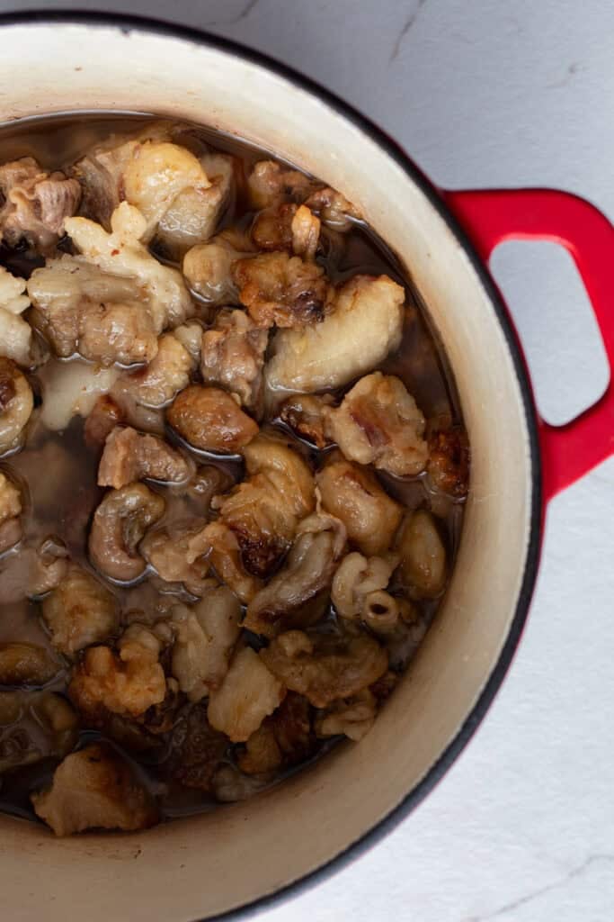 Beef fat rendered in a Dutch oven.