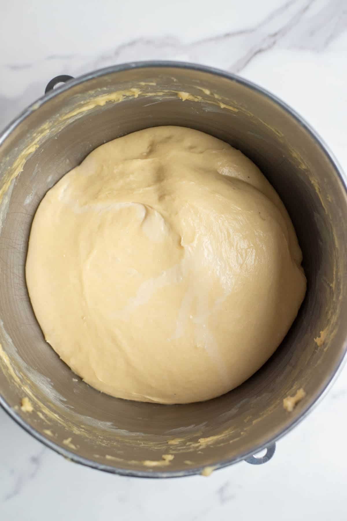 Sourdough in a stainless steel mixing bowl that has doubled. 