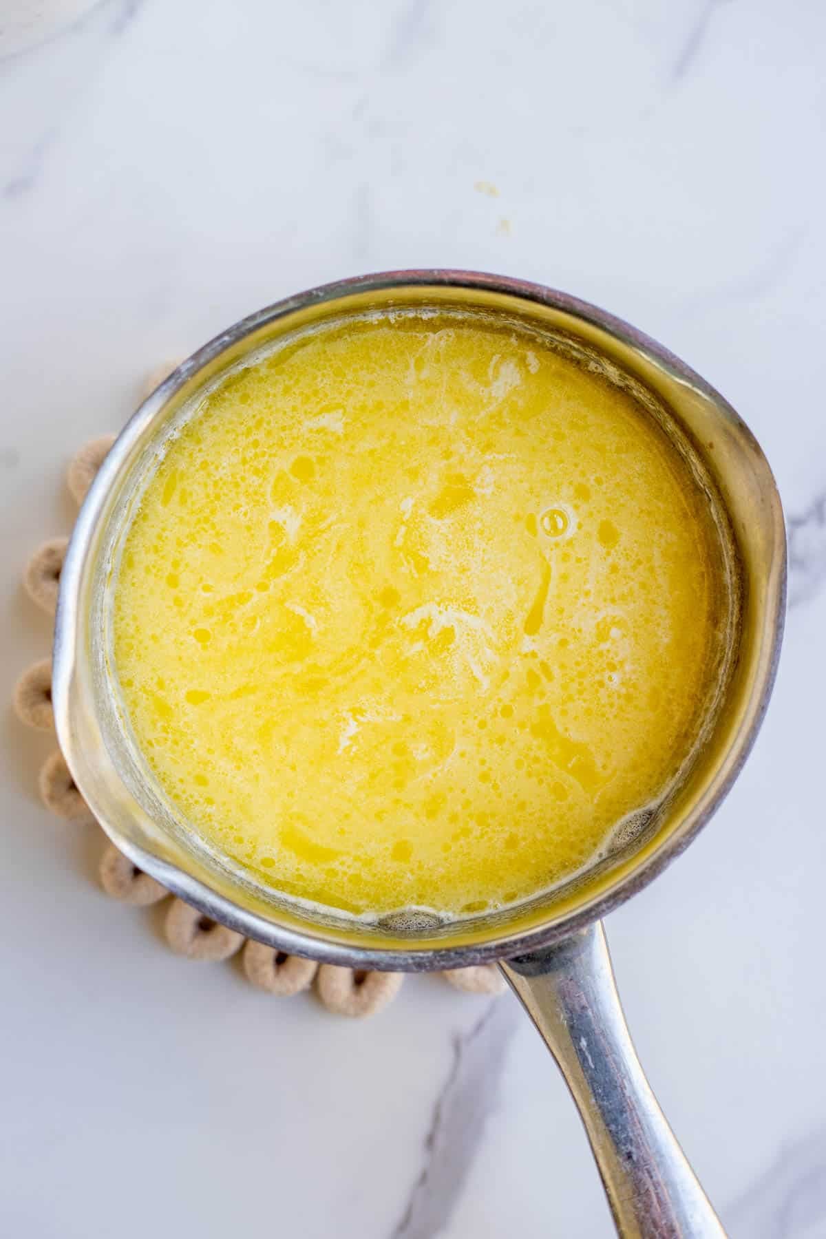 Melted butter in a small saucepan.