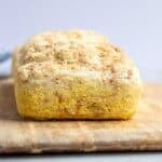 A loaf of bread on a cutting board.