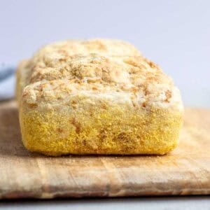 A loaf of bread on a cutting board.