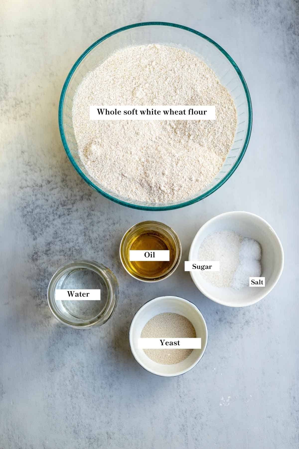 Ingredients in bowls on a white counter top.
