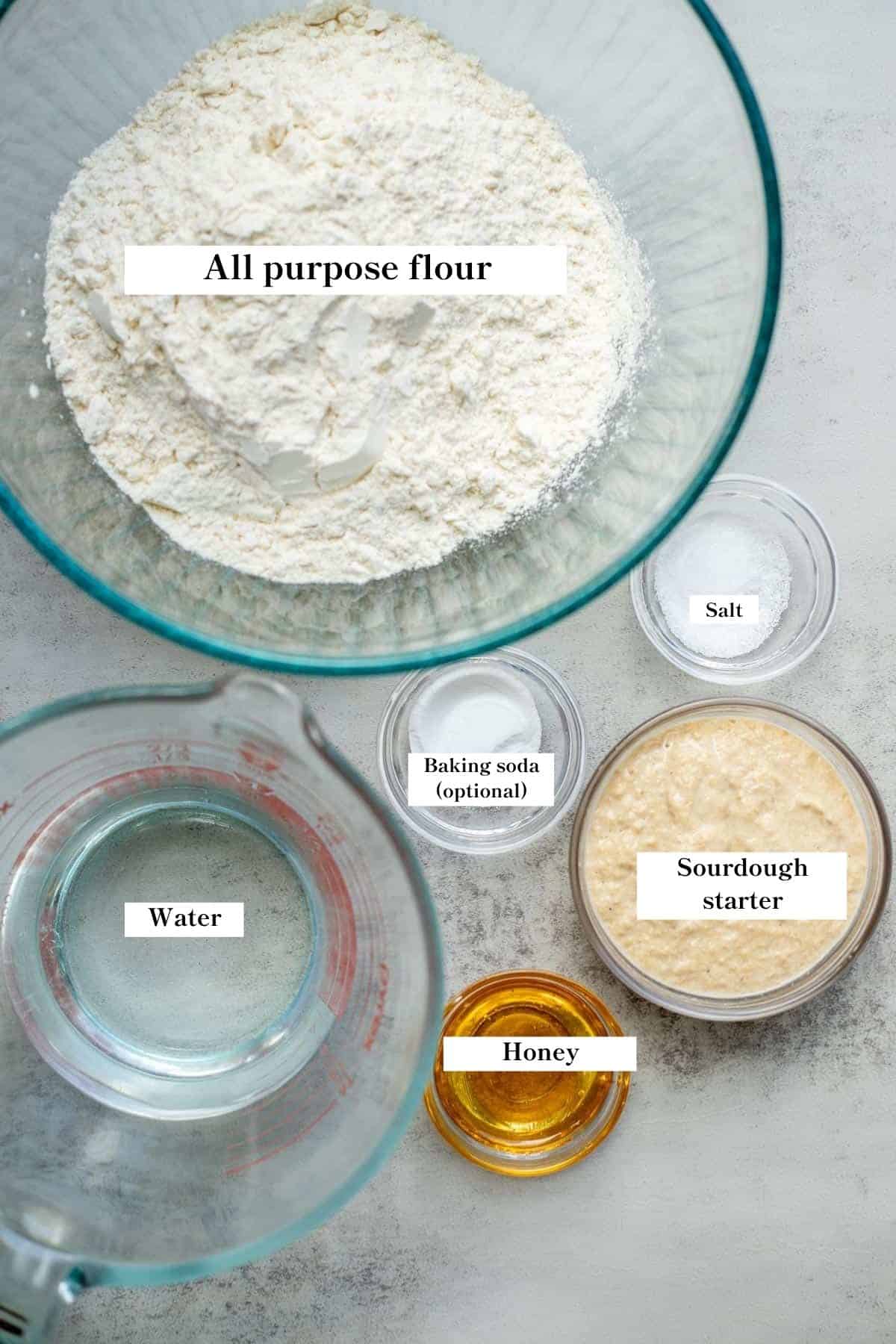 Bowls with ingredients in them for bread.