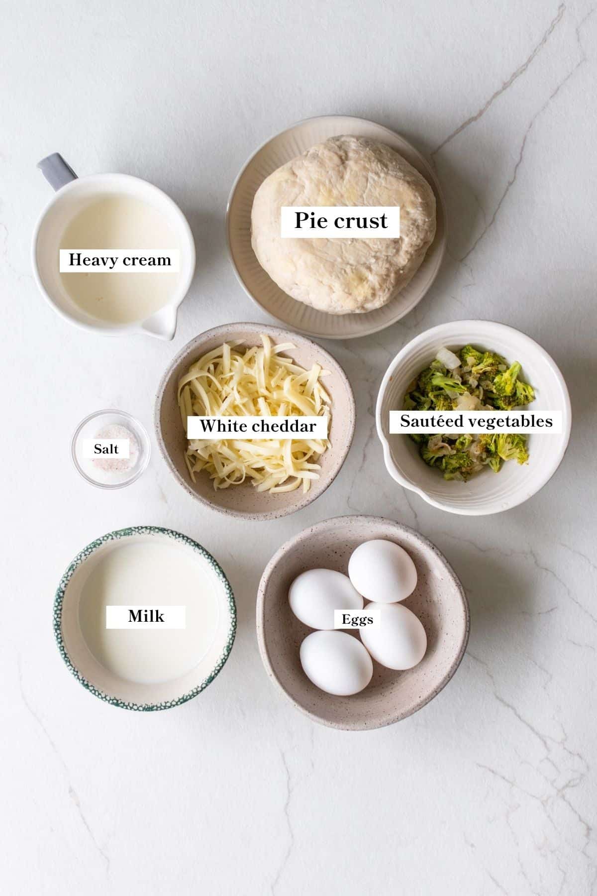 Ingredients in bowls for mini quiches.