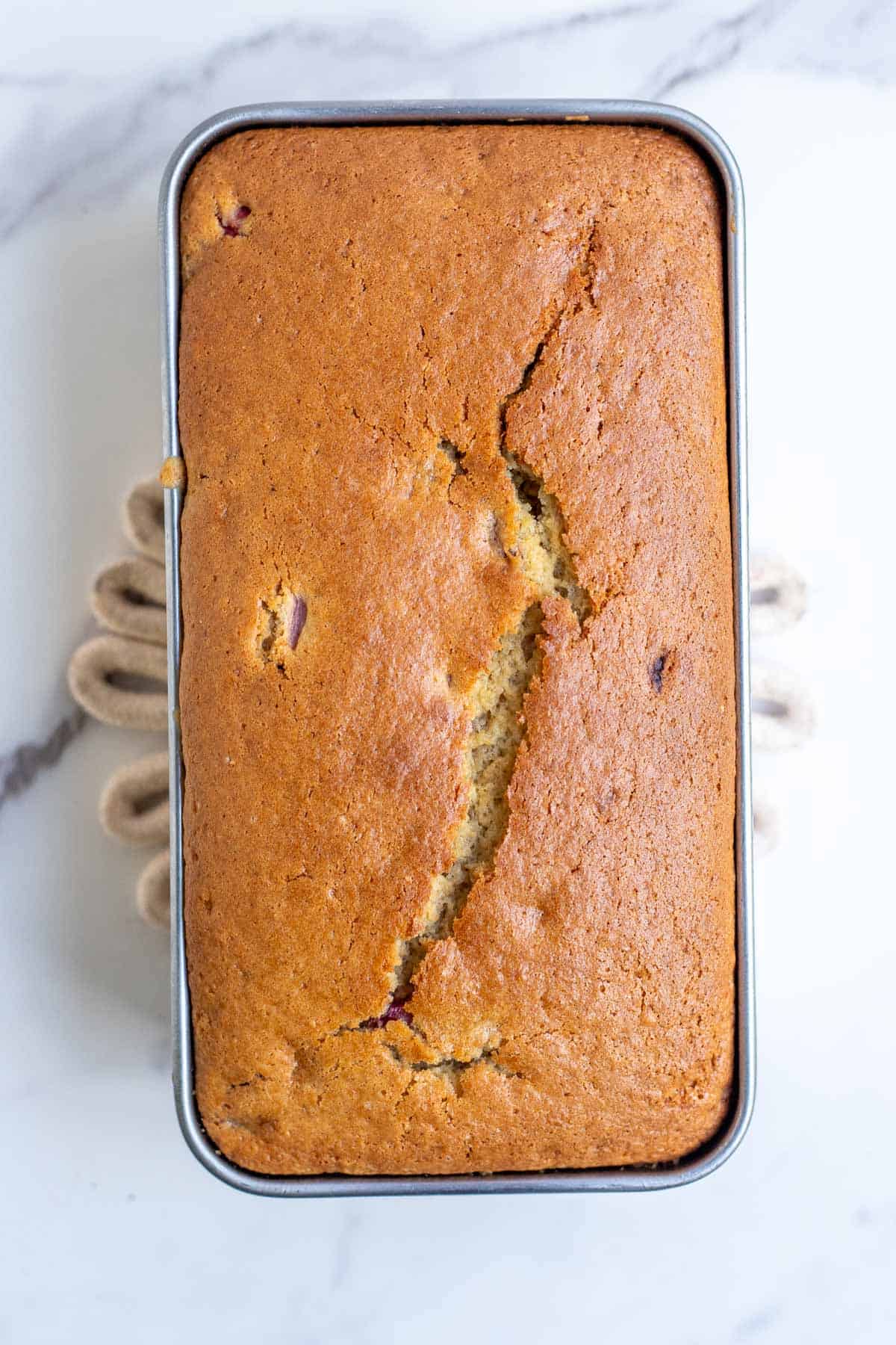A loaf of sourdough strawberry bread fresh from the oven.