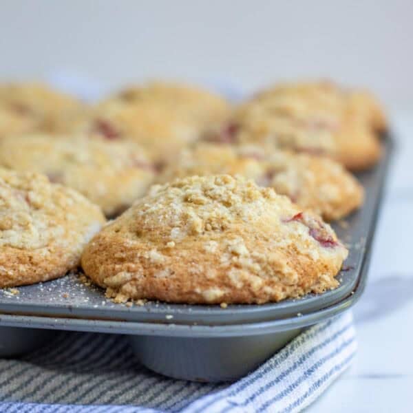 fully cooked sourdough strawberry muffins in a muffin tin.