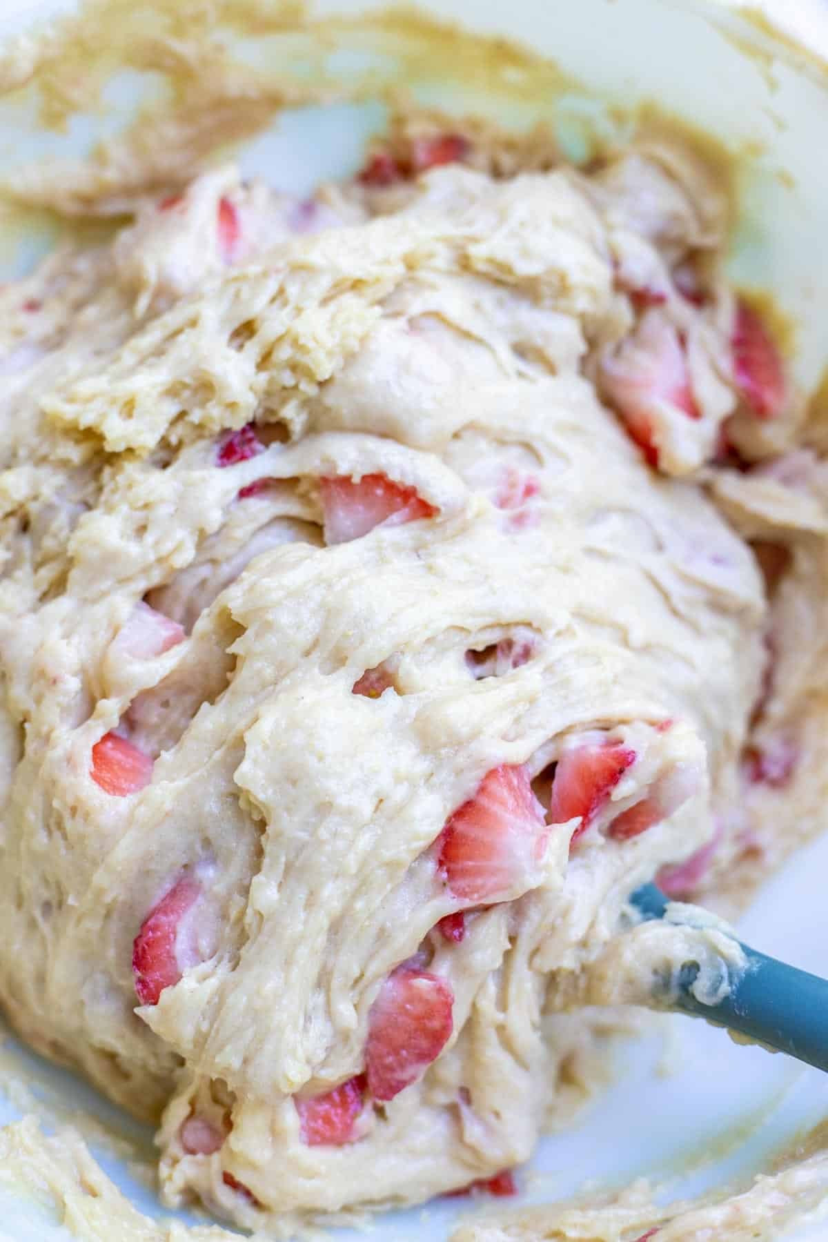 Diced strawberries folded into a sourdough muffin batter.
