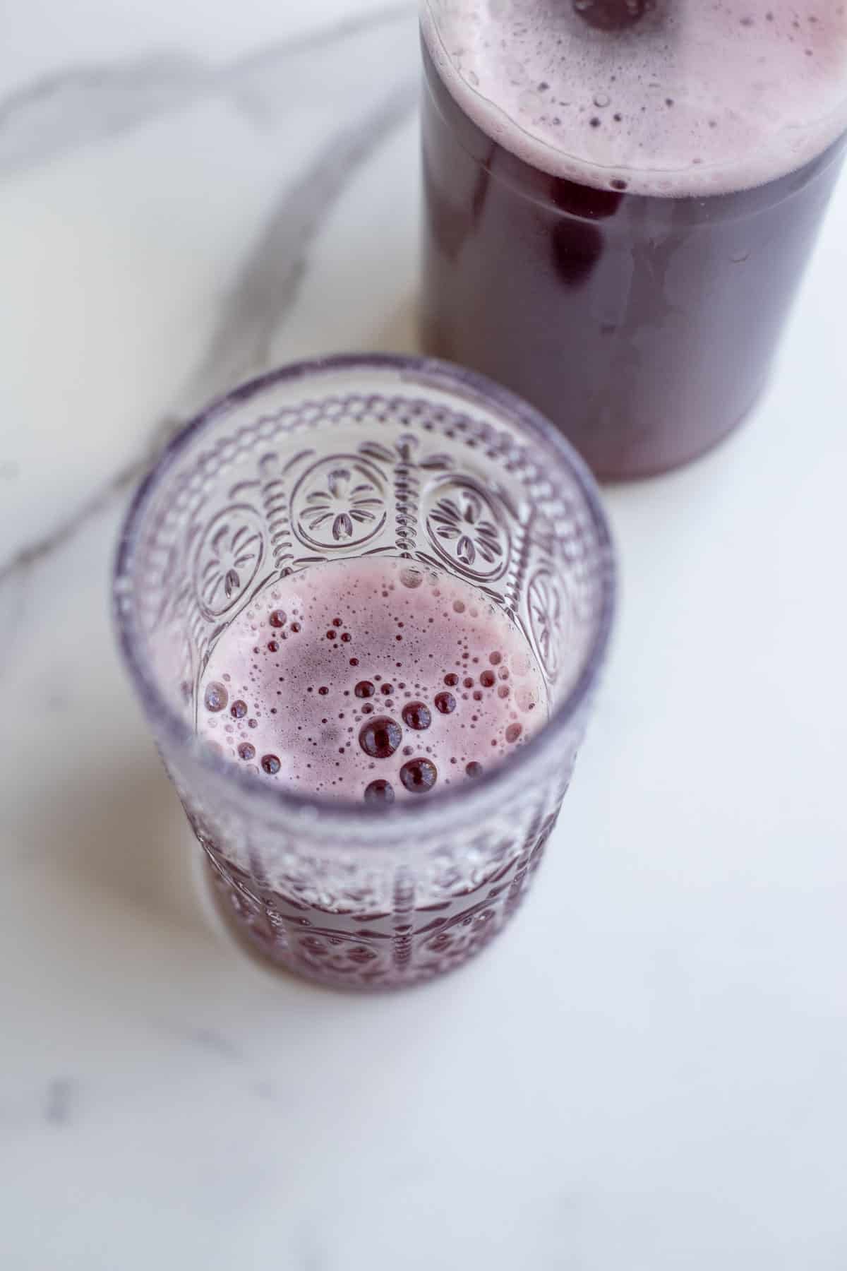 a fizzy glass of grape juice water kefir. 