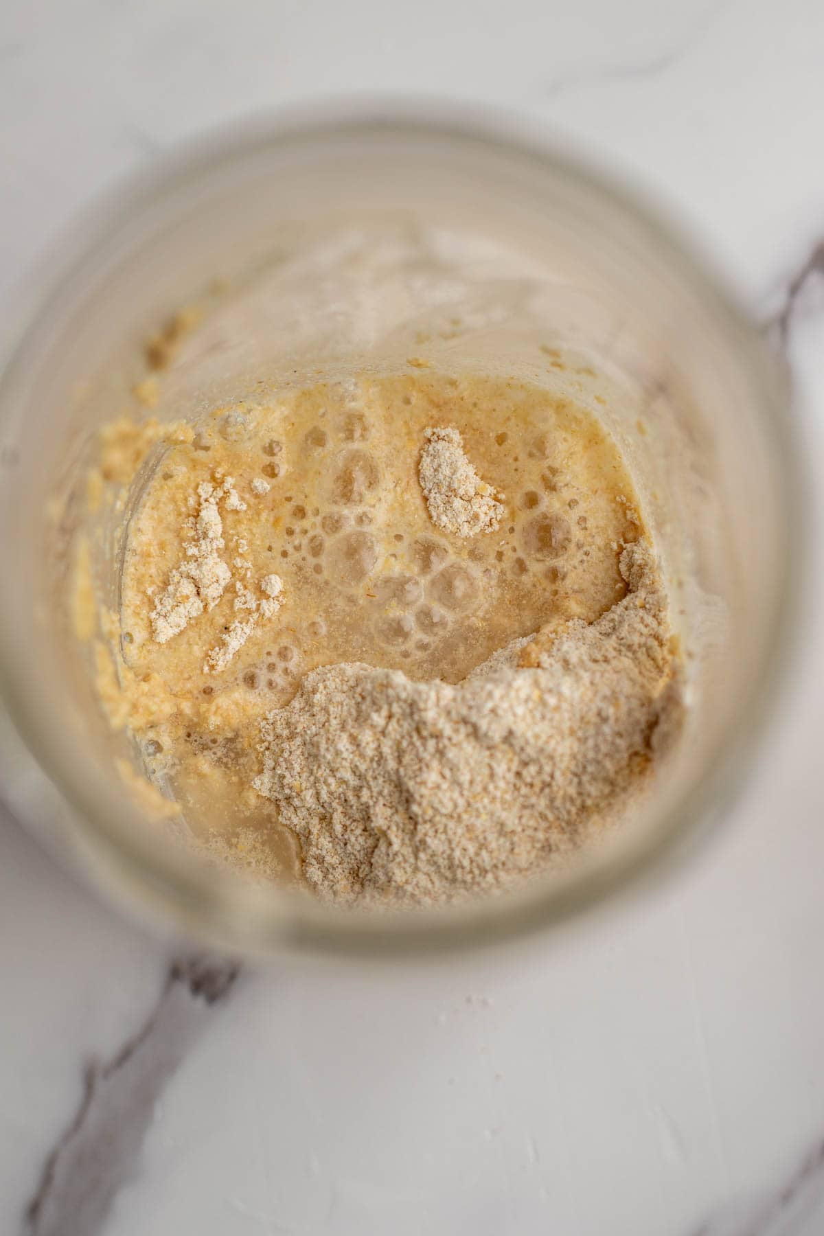 Flour and water in a mason jar to make a sourdough starter.