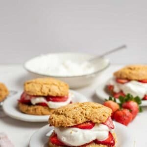 Three plates with strawberry shortcake on them.
