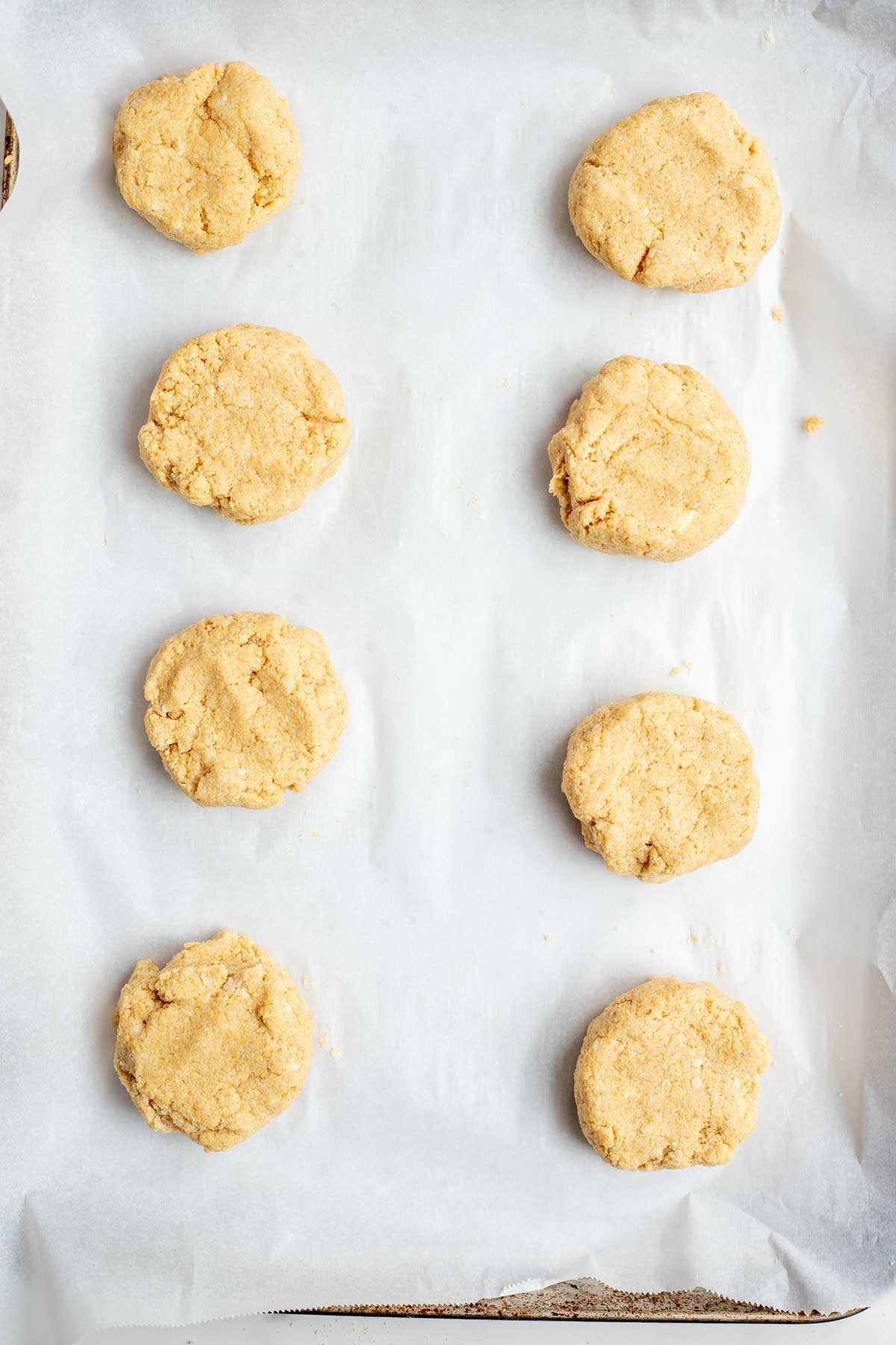 Dough circles on parchment paper.