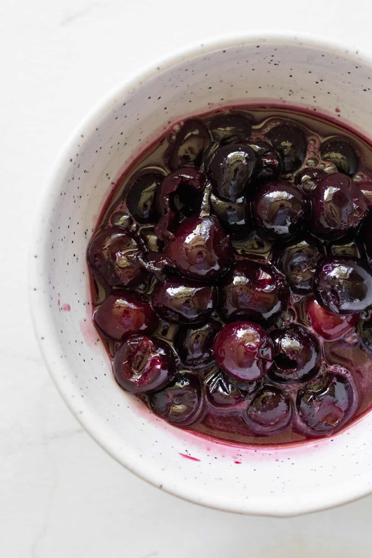 Cherries in a small bowl.