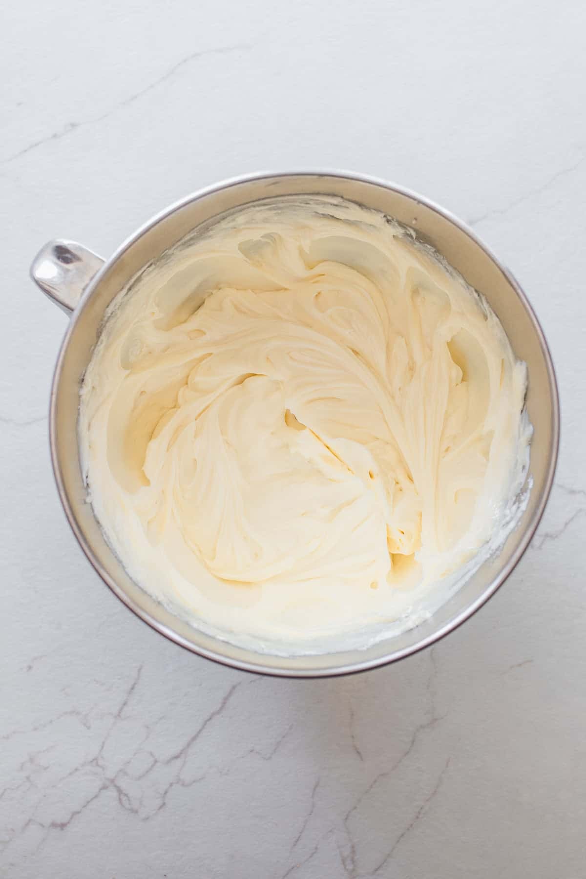 Cream cheese whipped in a bowl.