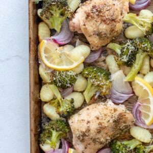 A sheet pan of homemade gnocchi, chicken, and veggies.