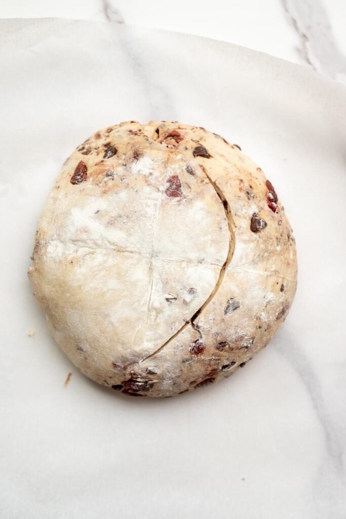 Scoring the chocolate cherry sourdough bread before baking.