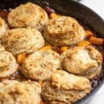 sourdough peach cobbler in a cast iron skillet.