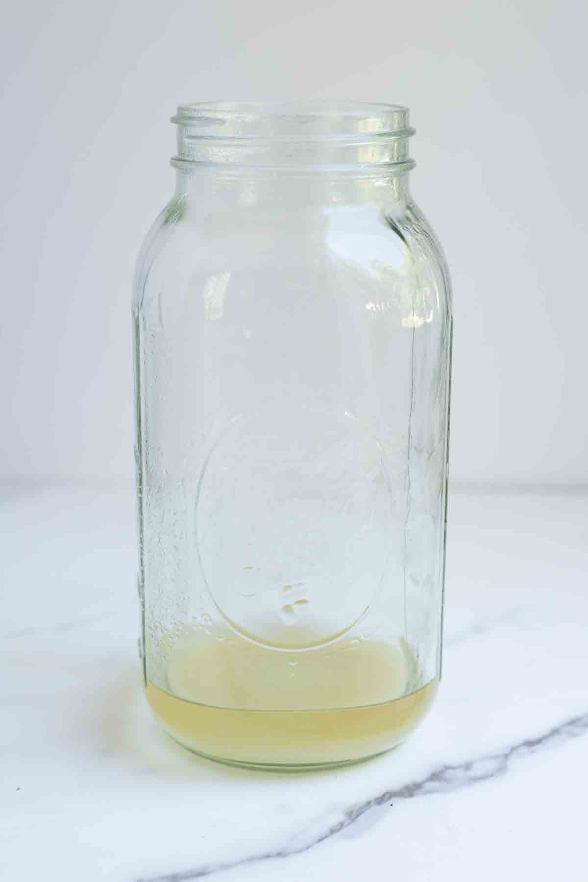 Boiled water and sugar in a half gallon mason jar.