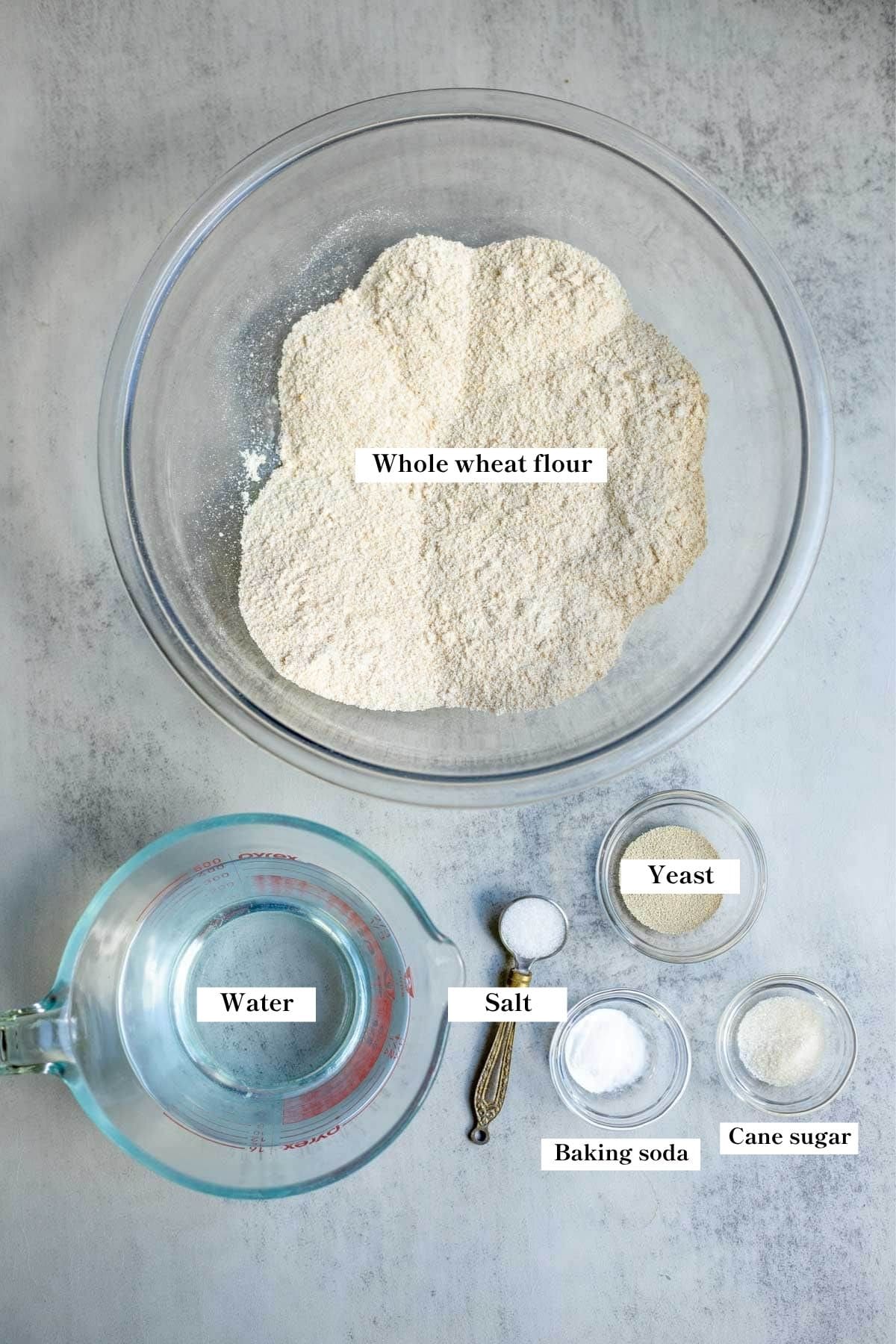 Ingredients for whole wheat crumpets in individual bowls.