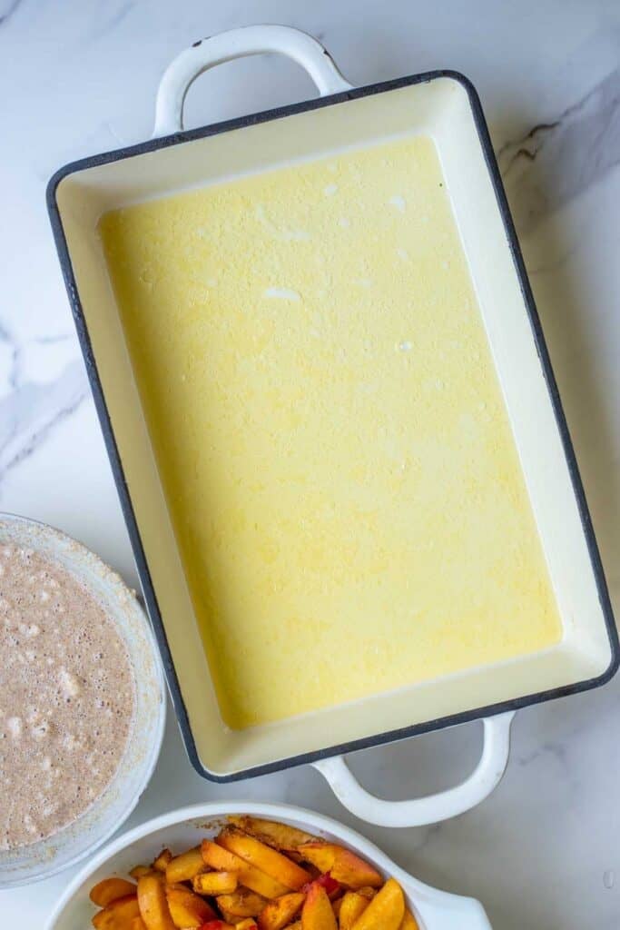 Butter melted in a 9" x 13" pan.