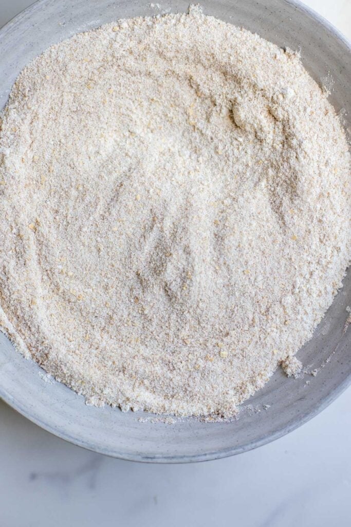 Dry ingredients for cobbler mixed together in a bowl.