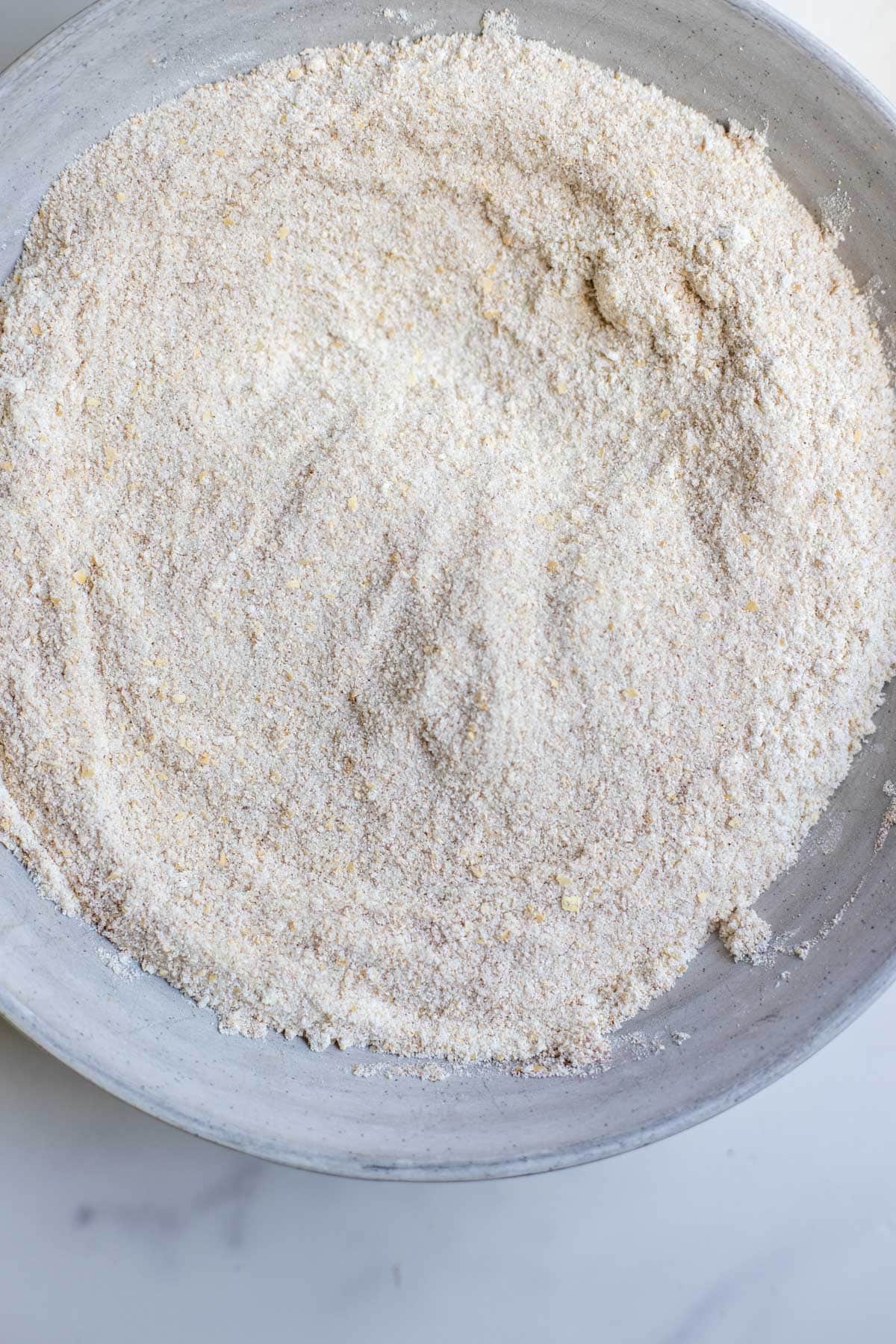 Dry ingredients for cobbler mixed together in a bowl.