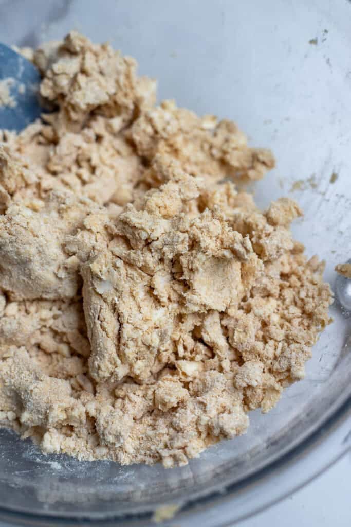 Cold butter incorporated with freshly milled flour in a large mixing bowl.