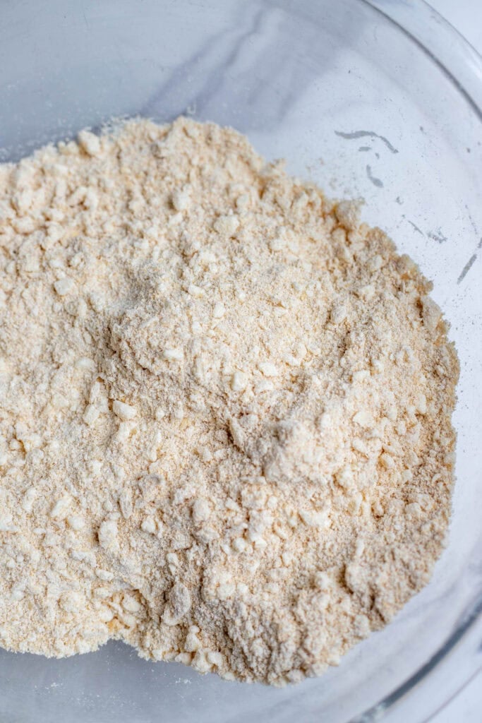 Freshly milled flour and salt in a large glass mixing bowl.