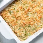 A casserole dish of zucchini gratin baked to golden brown.