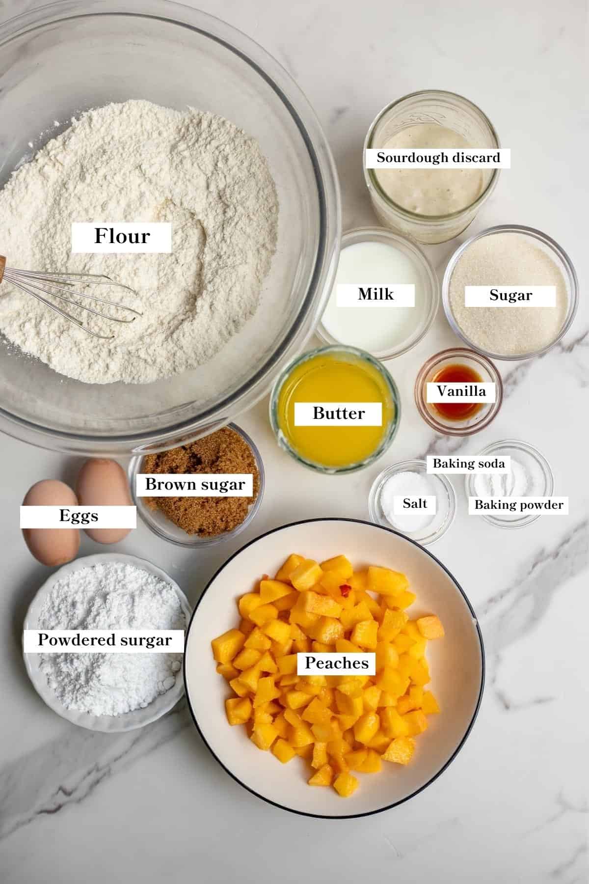 Ingredients for sourdough peach bread measured out on the counter.