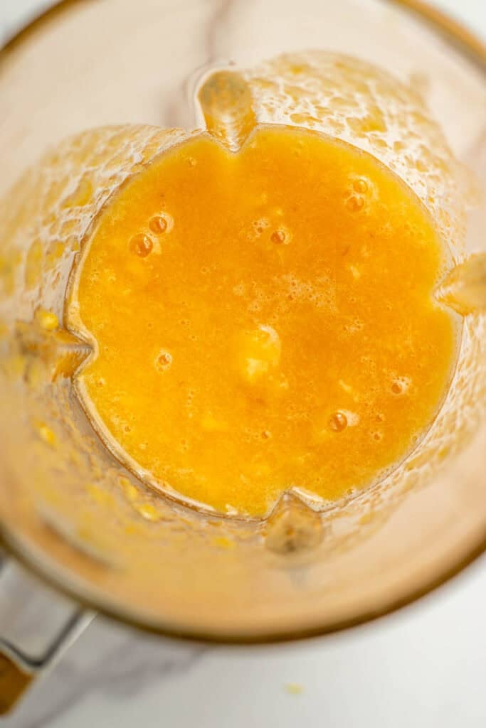 Peaches pureed together in a blender.