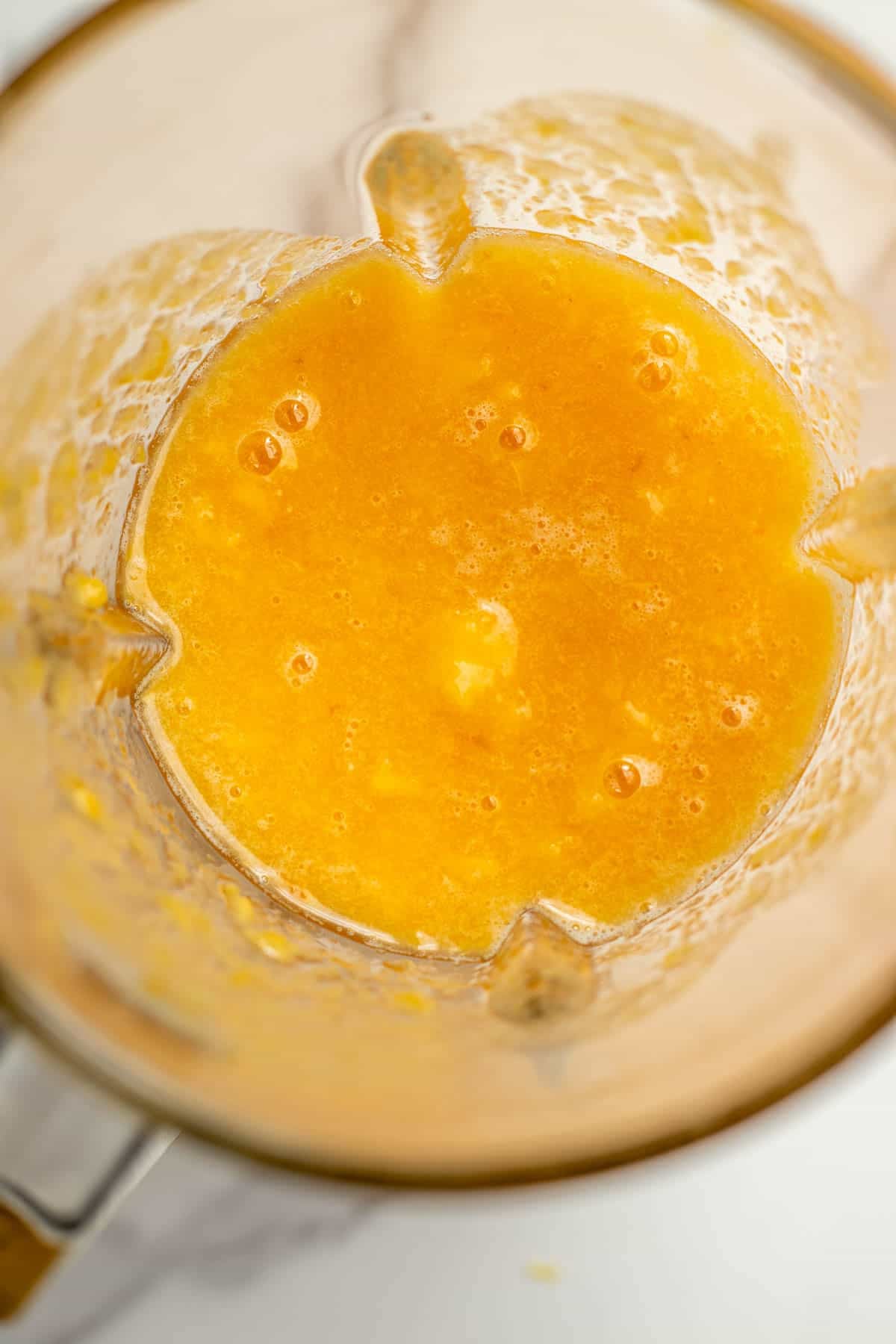 Peaches pureed together in a blender.
