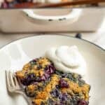 a slice of whole wheat blueberry cobbler on a dessert plate.
