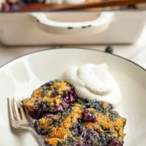 a slice of whole wheat blueberry cobbler on a dessert plate.