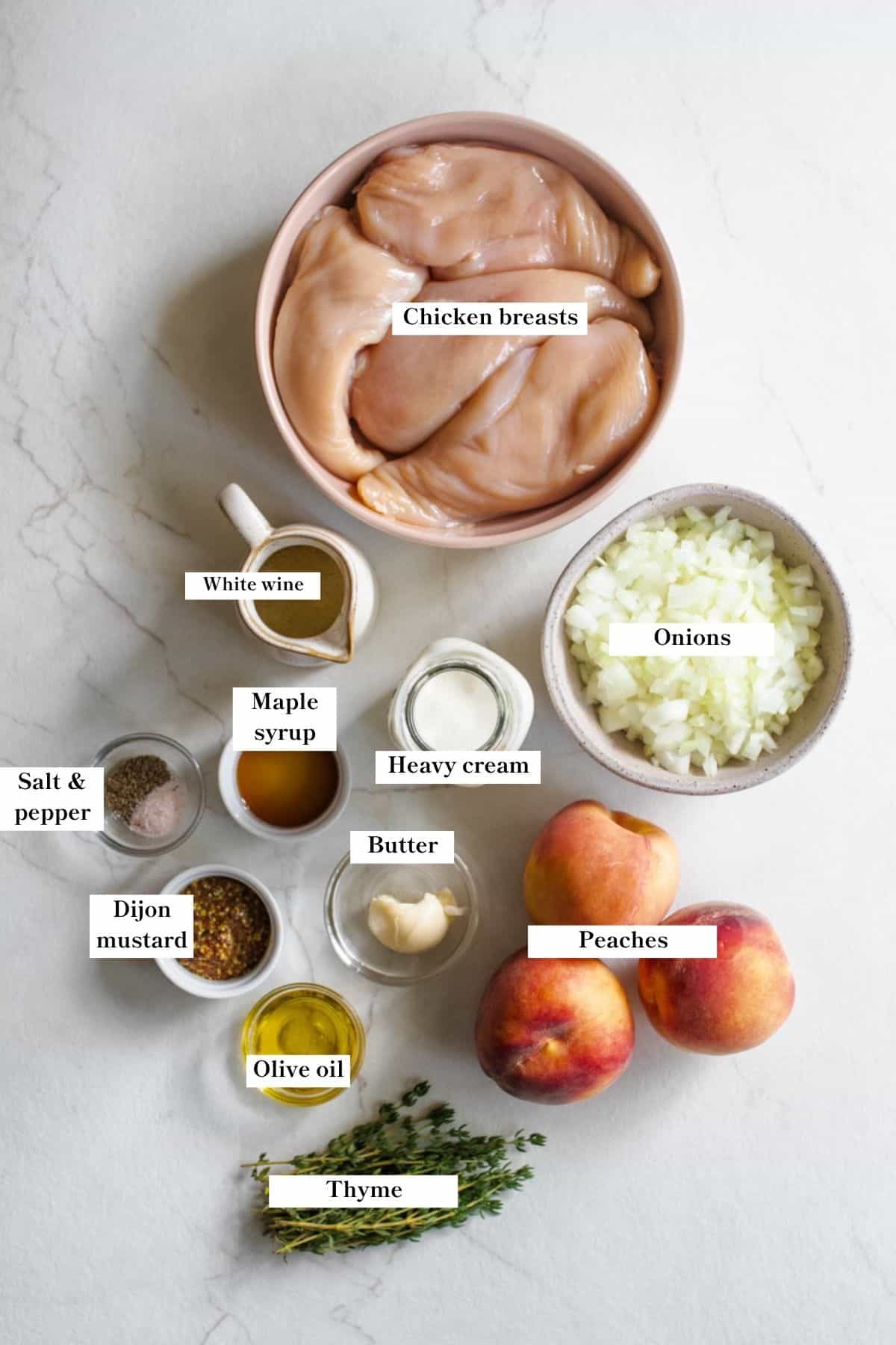 Ingredients for peach chicken in various sized bowls on a counter top.