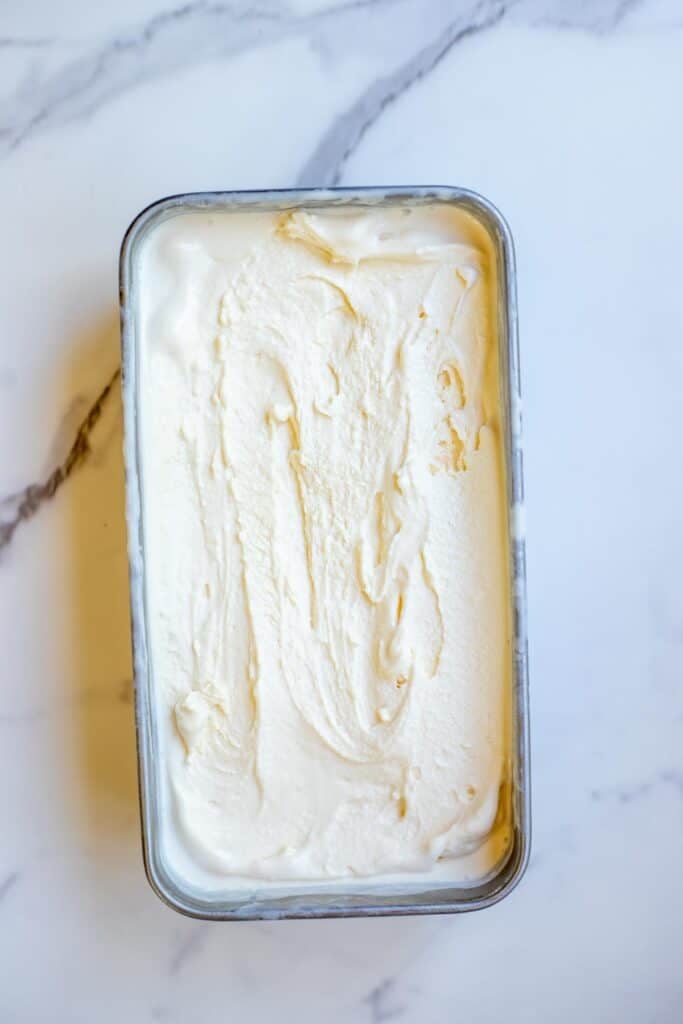 Ice cream in a loaf pan on a countertop.