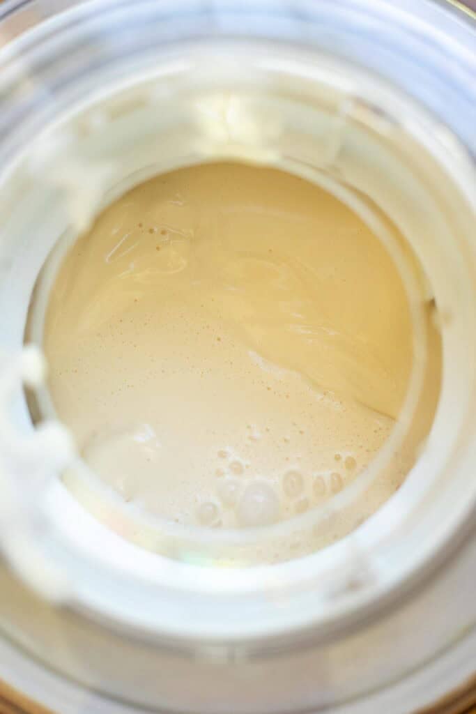 Ice cream mixture poured into an ice cream mixture ready for churning.