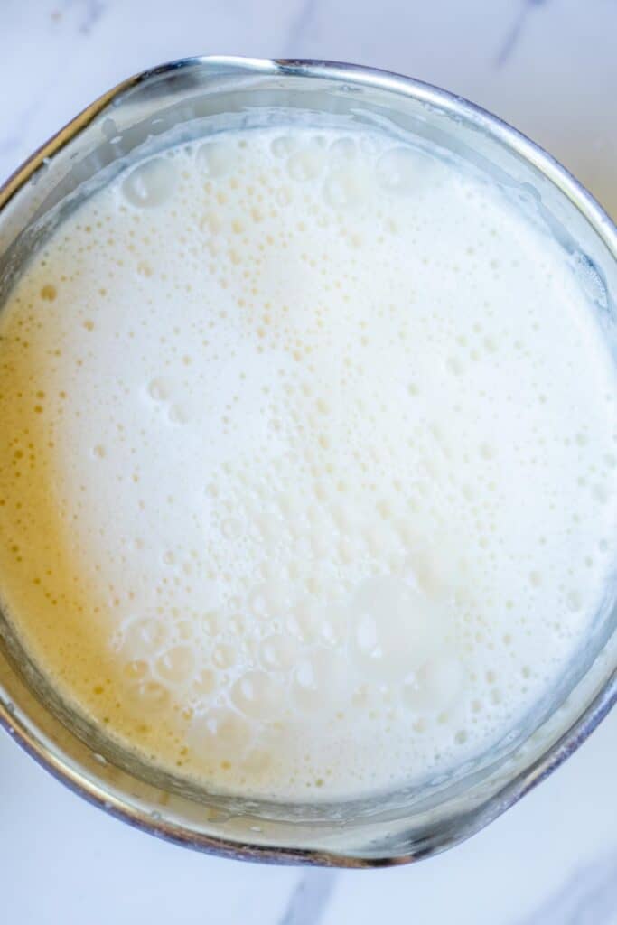 Cream bubbling in a saucepan.