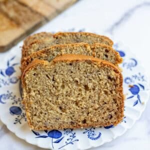 two slices of sourdough banana bread on a blue dessert plate.